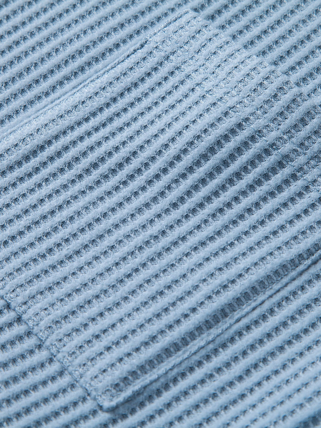 Tejido piqué a rayas de los pantalones cortos de punto celestes