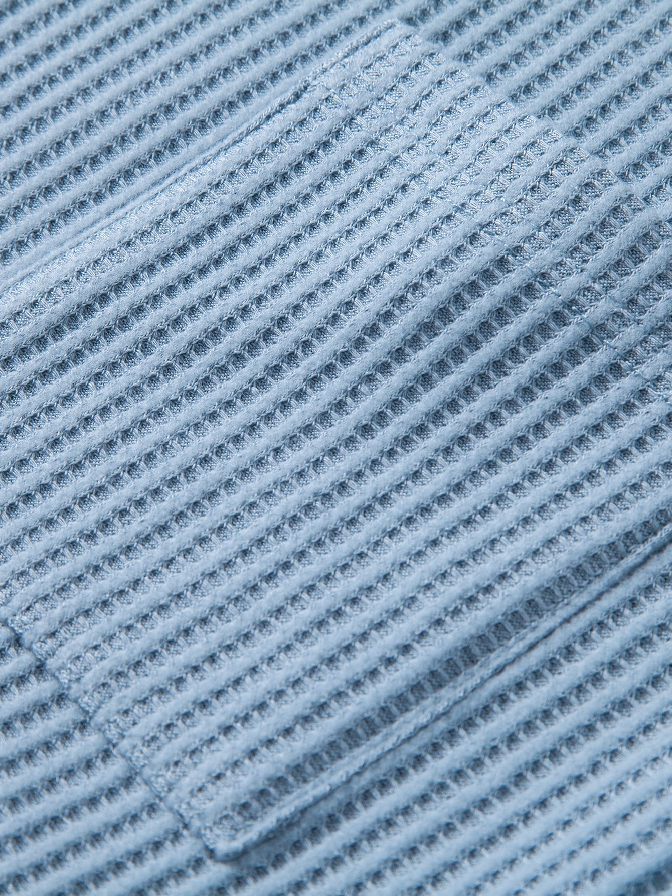Tejido piqué a rayas de los pantalones cortos de punto celestes