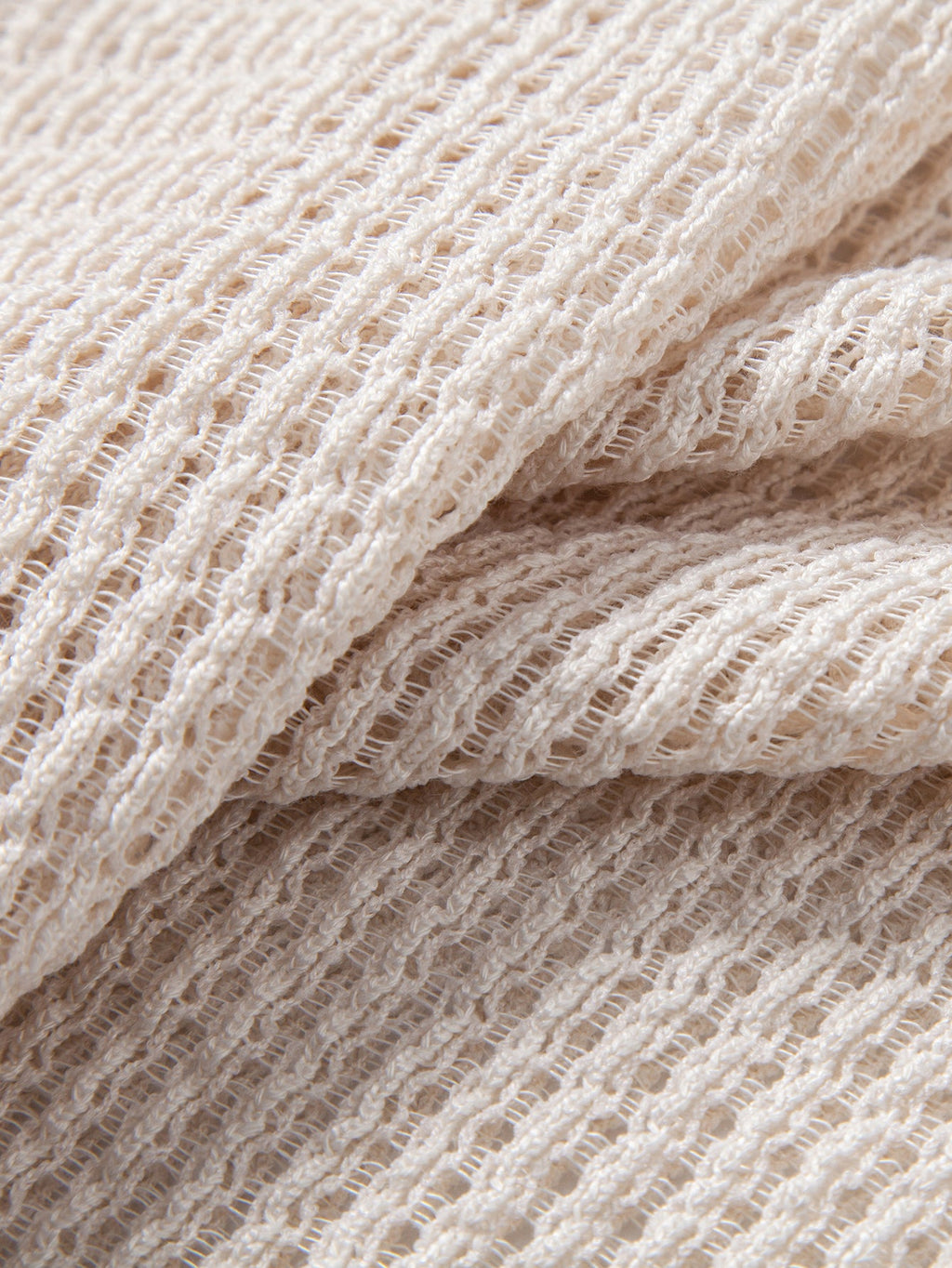 Polo de punto a ganchillo beige, tejido calado con textura marcada