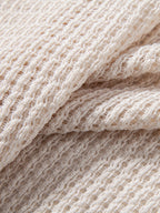 Polo de punto a ganchillo beige, tejido calado con textura marcada