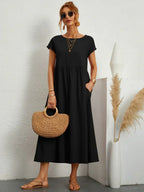Vestido midi negro con manga corta y falda fruncida
