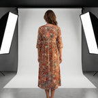 Vestido Amalfi midi floral de manga tres cuartos, espalda descubierta, caída suelta.