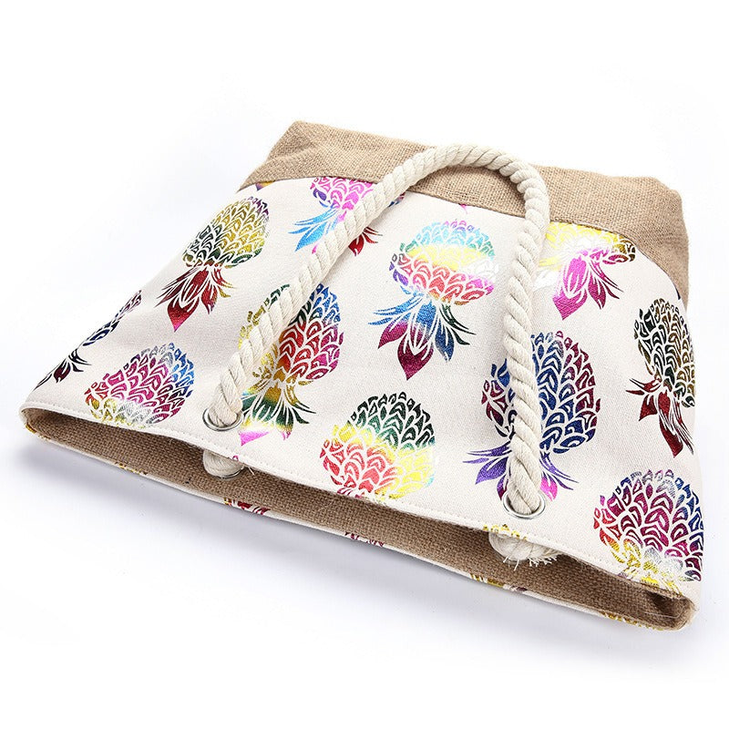 Bolso tote con cierre y estampado multicolor de piñas, asas de cuerda trenzada