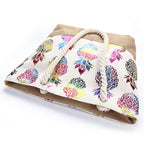 Bolso tote con cierre y estampado multicolor de piñas, asas de cuerda trenzada