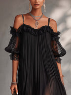 Vestido negro de gasa con escote en V, volantes en los hombros y mangas tipo farol