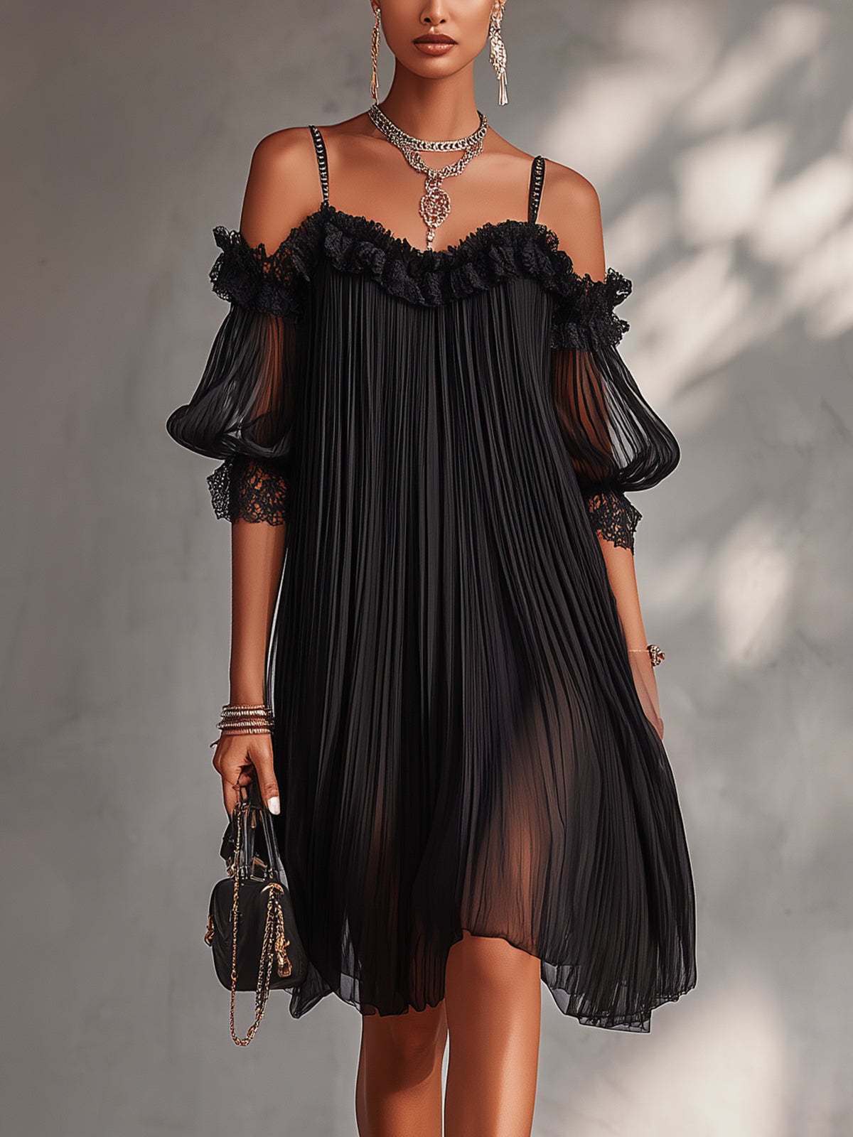 Vestido negro de gasa con escote en V y hombros descubiertos con volantes