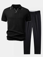 Conjunto de polo negro con cuello y pantalón ajustado cónico negro.