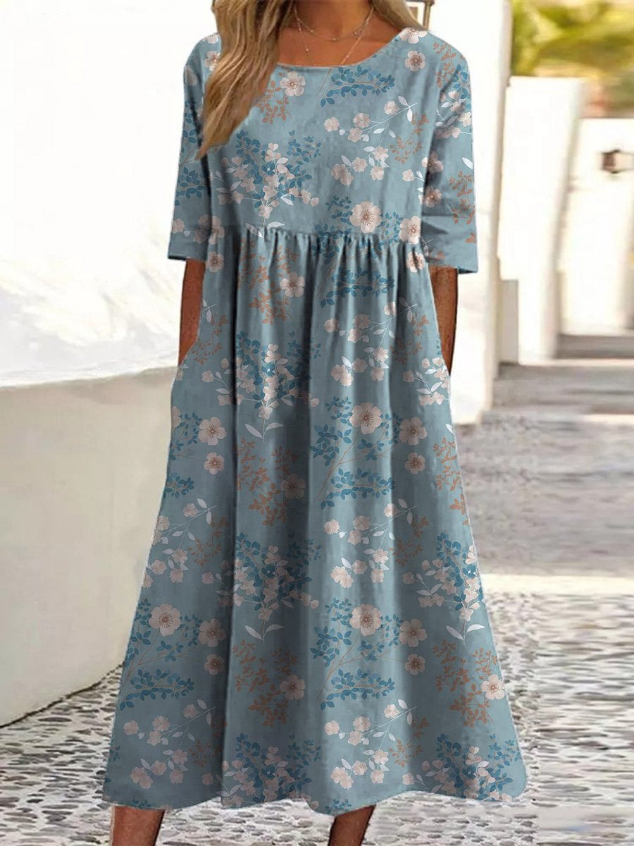 Vestido azul claro con estampado de florecitas, fruncido en cintura y manga corta