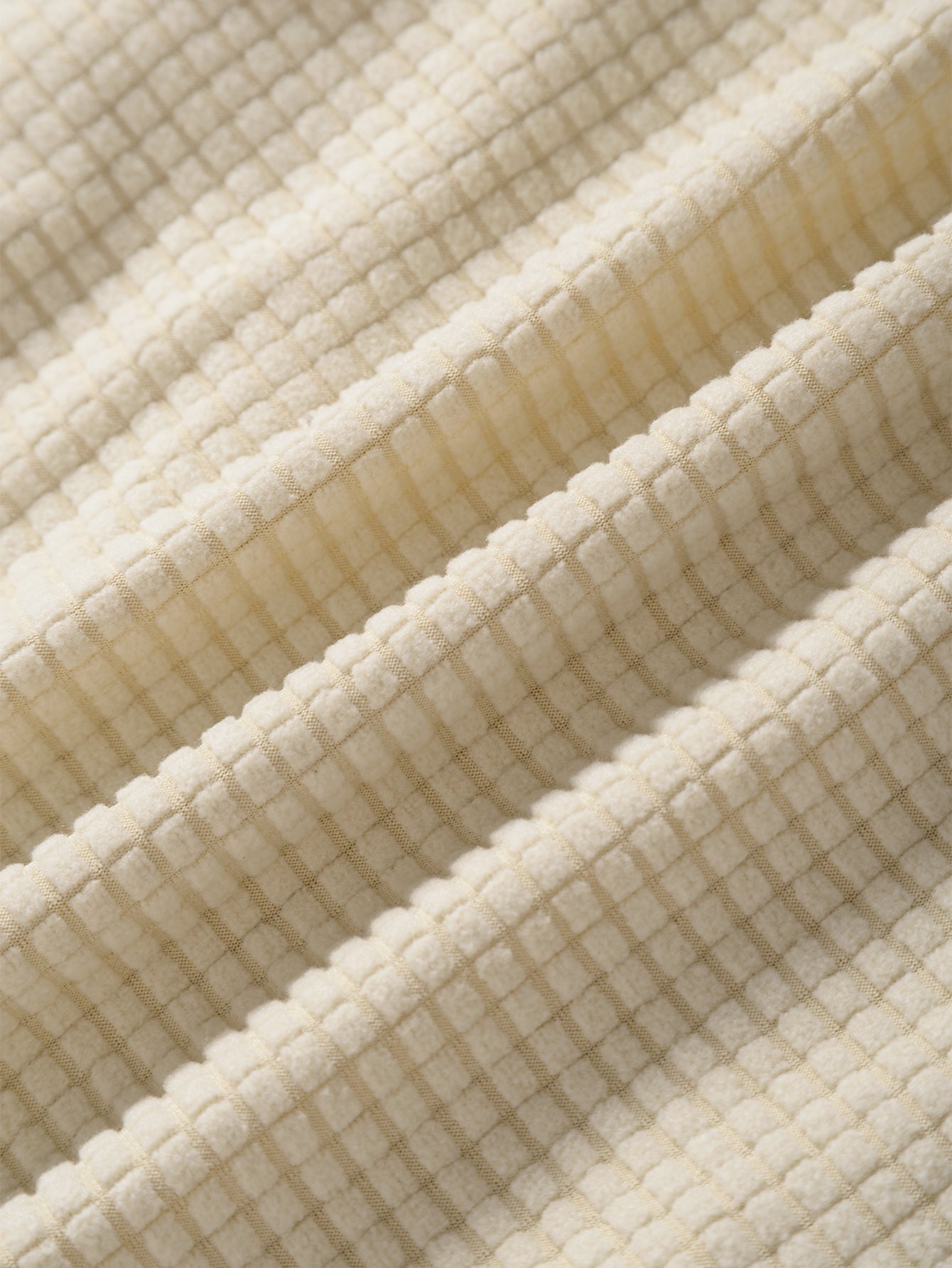 Tela de camisa beige texturizada con relieve cuadriculado
