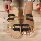 Sandalias Vega con tiras negras y brillo, hebillas doradas y suela de esparto