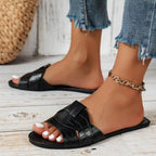 Sandalias Noa negras estilo slide con tiras anchas y suela plana