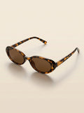 Gafas Aurora Lumière con montura carey y lentes oscuras ovaladas
