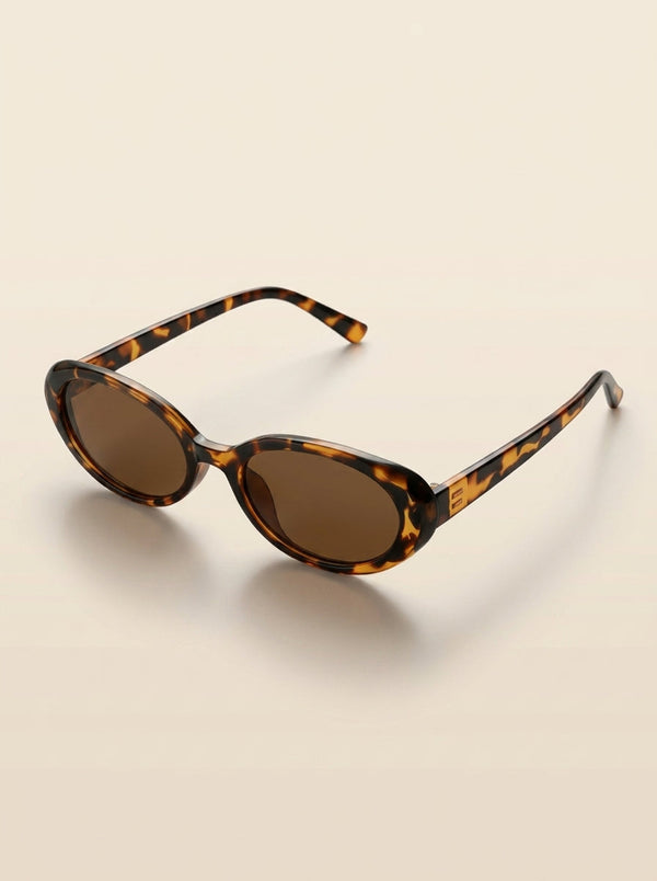 Gafas Aurora Lumière con montura carey y lentes oscuras ovaladas