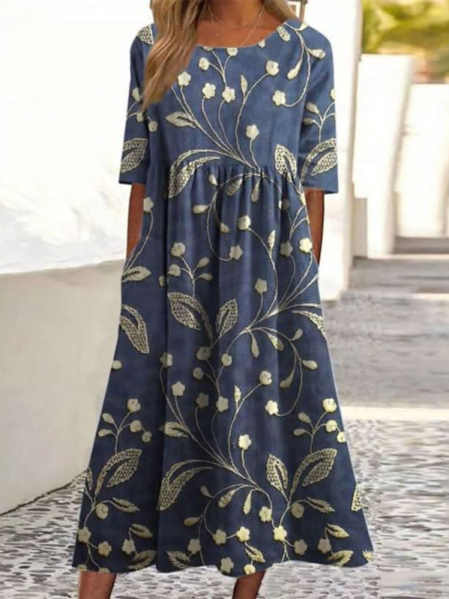 Vestido azul marino con estampado floral y de hojas, manga corta y falda amplia