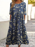 Vestido azul marino con estampado floral y de hojas, manga corta y falda amplia