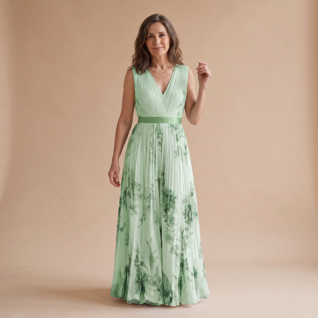 Vestido largo sin mangas verde menta, escote V cruzado y falda plisada con estampado