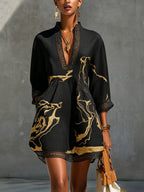 Minivestido negro con estampado de mármol dorado, escote en V y manga 3/4