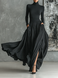 Conjunto con top de manga larga y cuello alto negro real, falda larga plisada con abertura