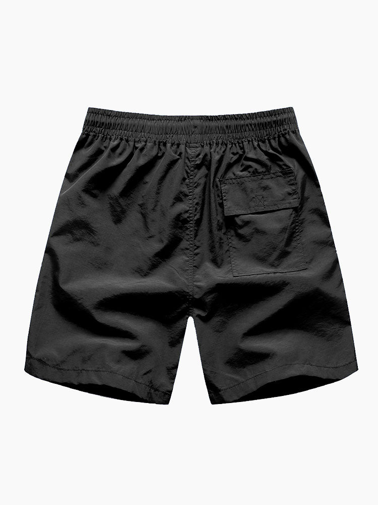Bañador corto negro con bolsillos tipo parche y cintura elástica
