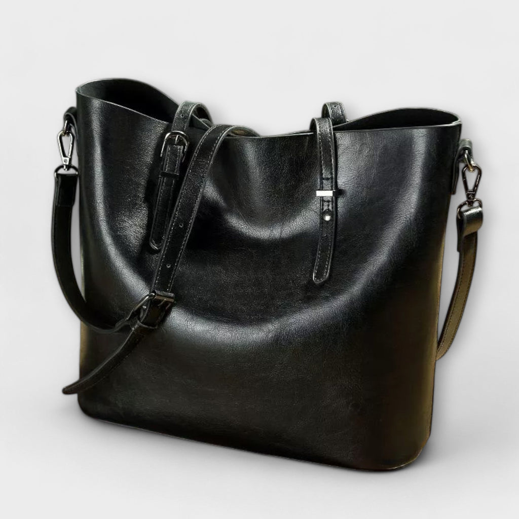 Bolso Tavrèa negro de piel con bandolera y doble asa frontal