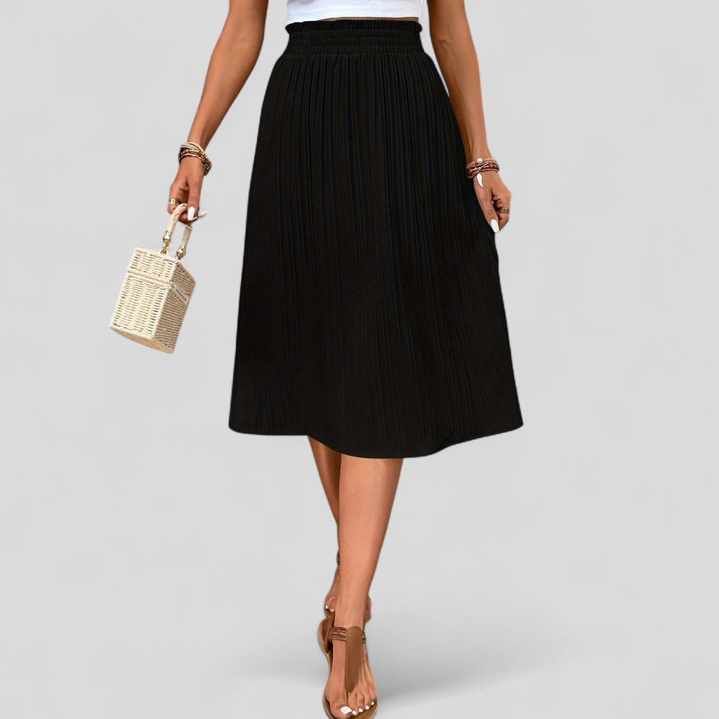 Falda midi plisada negra con cintura elástica y dobladillo midi