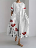 Vestido fluido blanco con estampado floral rojo, manga corta y falda con vuelo