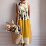 Vestido midi sin mangas bicolor con lunares negros y franjas amarillas y crema