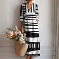 Vestido midi estampado gráfico en blanco y negro, escote V y mangas 3/4