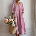 Vestido de lino rosa con escote en V, mangas tres cuartos y panel a rayas