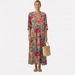 Vestido midi floral multicolor con escote en V, mangas 3/4 y falda amplia