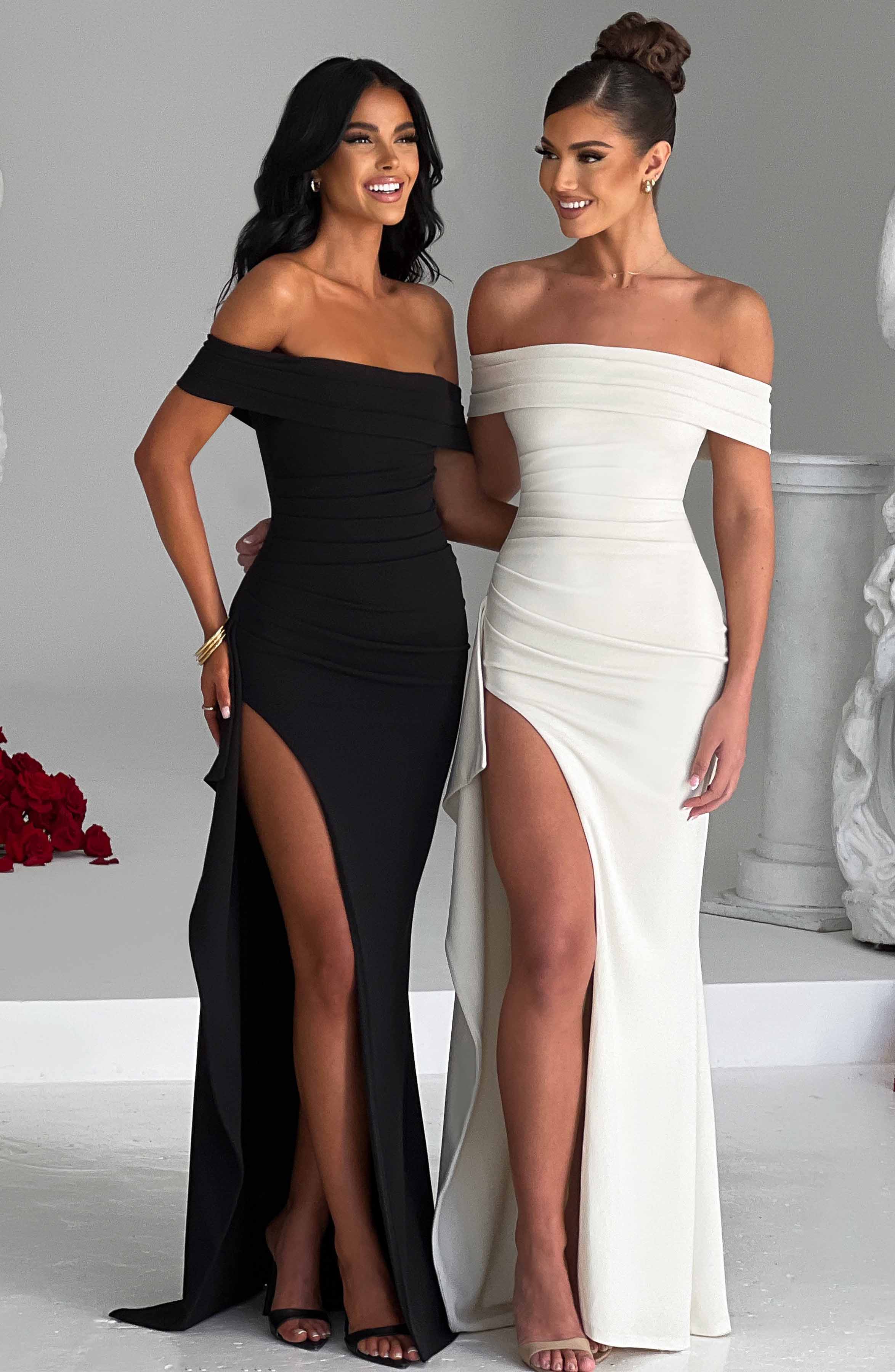 Vestidos largos negro y blanco con escote off-shoulder y abertura frontal