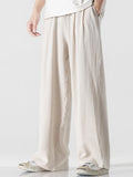 Pantalón wide leg de lino y algodón color beige claro, pierna suelta y caída amplia.