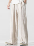 Pantalón wide leg de lino y algodón color beige claro, pierna suelta y caída amplia.