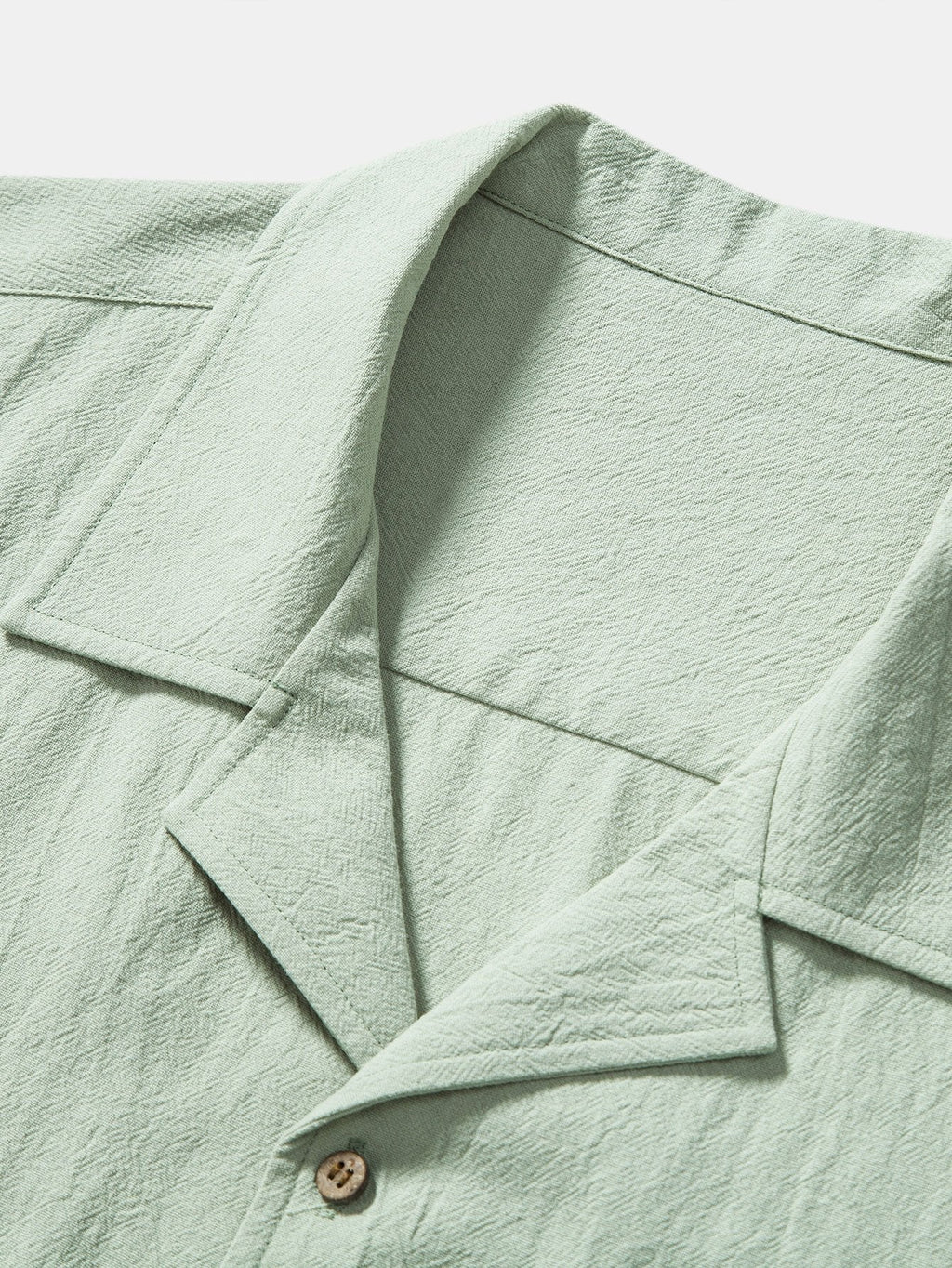 Camisa de algodón texturizado con cuello y botones, verde claro