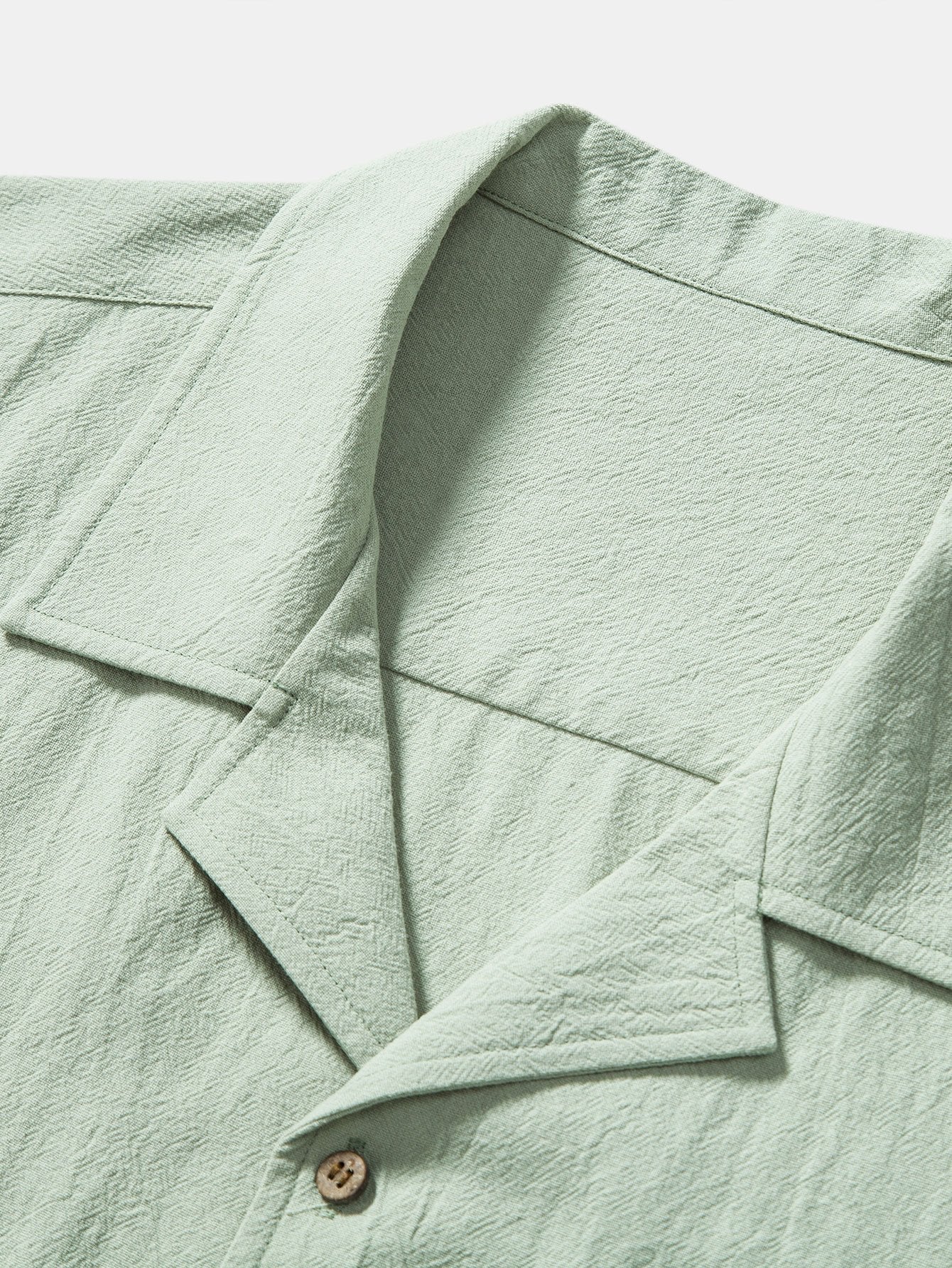 Camisa de algodón texturizado con cuello y botones, verde claro