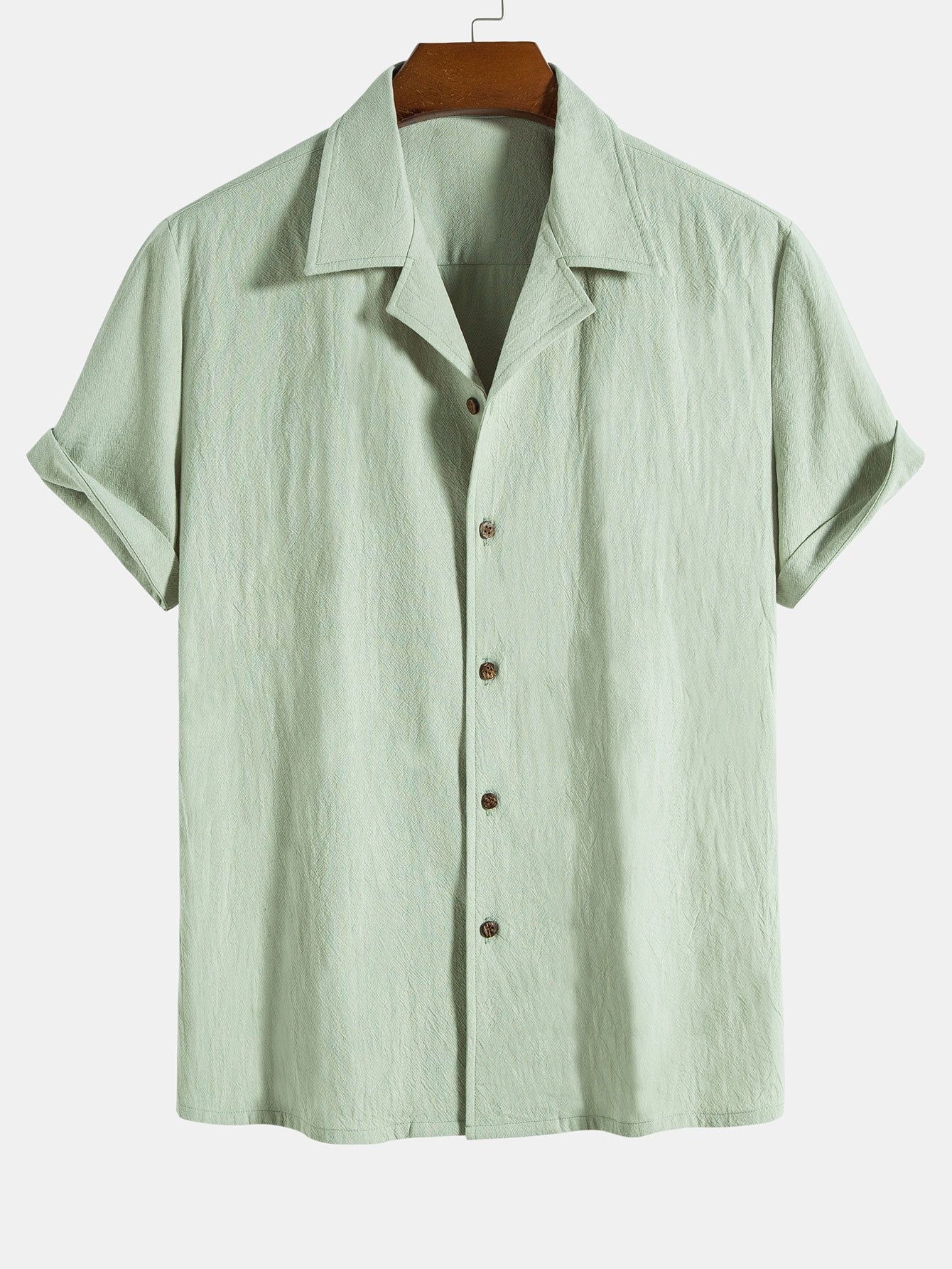 Camisa de algodón texturizado verde claro con botones y mangas cortas