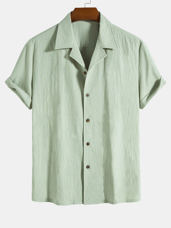 Camisa de algodón texturizado verde claro con botones y mangas cortas