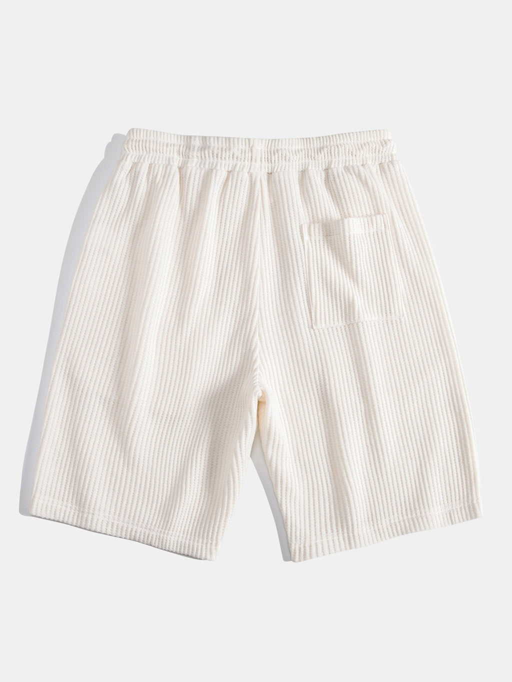 Pantalones cortos de punto beige con bolsillo y abertura frontal