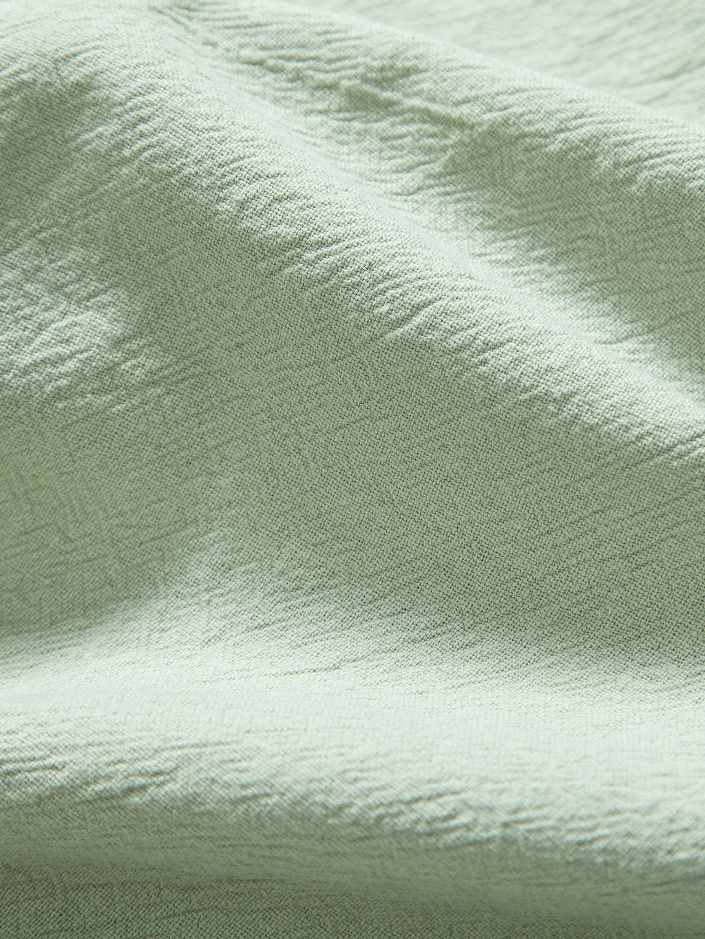 Tela de algodón texturizada en verde claro