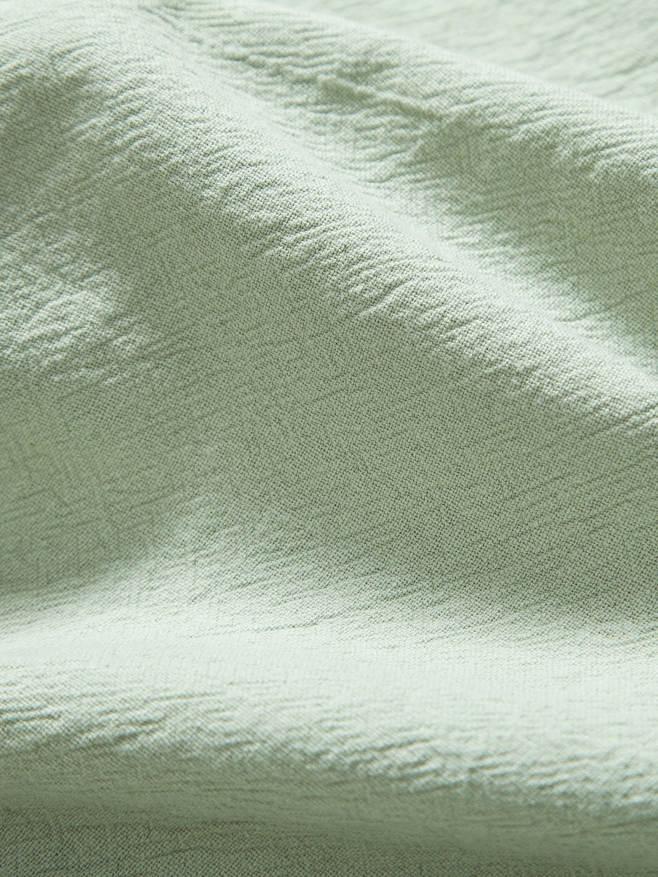 Tela de algodón texturizada en verde claro