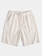 Pantalones cortos de punto beige con cordón y cintura elástica