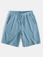 Pantalones cortos de punto celestes con cordón y cintura elástica