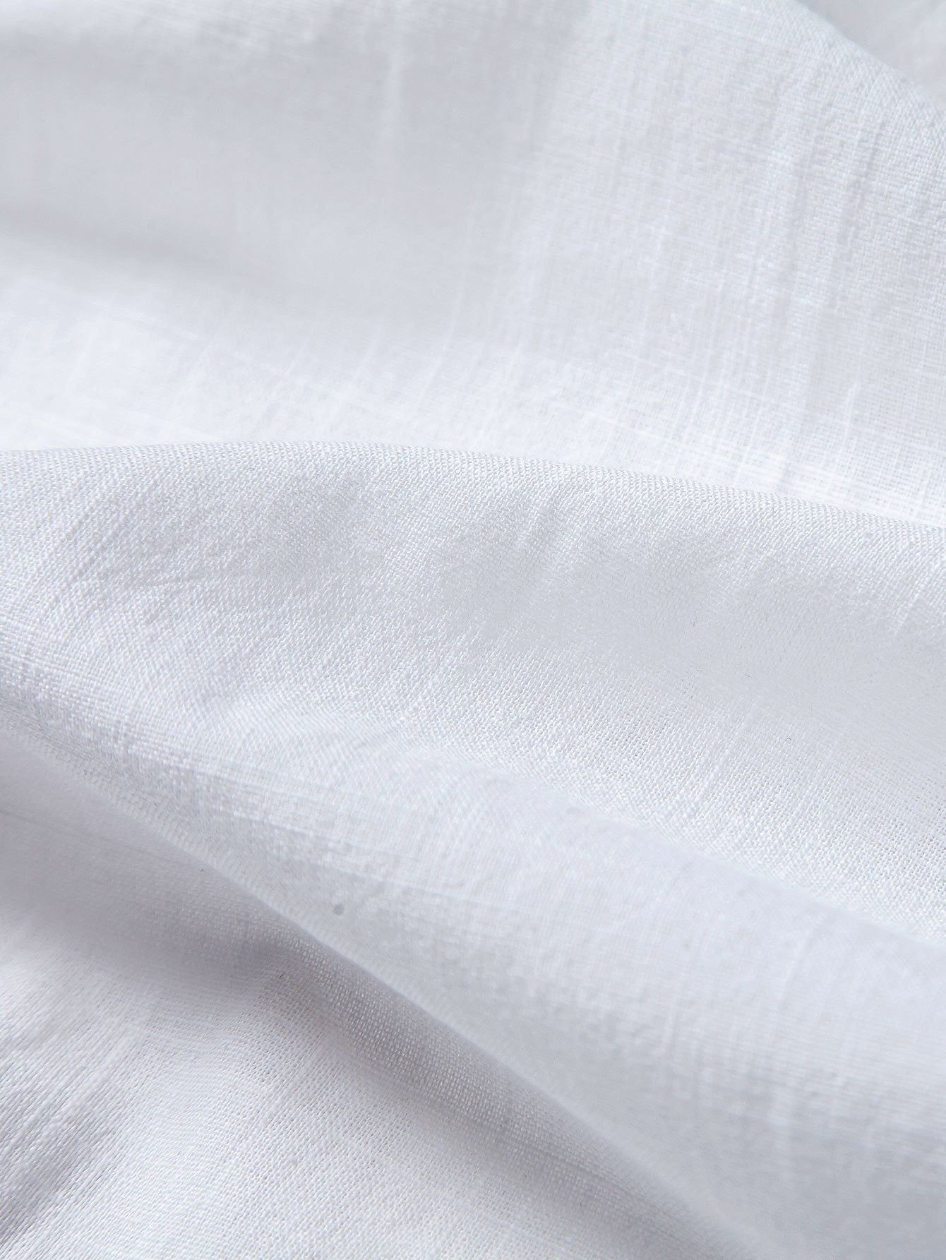 Tela blanca tipo lino de algodón, con textura sutil