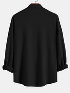 Camisa acanalada negra de manga larga con espalda y puños remangables