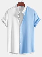 Camisa de dos tonos blanco y azul claro, cuello de pie acanalado, manga corta abotonada