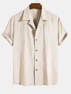 Camisa de algodón texturizado beige con botones y cuello camisero