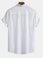 Camisa blanca de algodón tipo lino con caída y costuras traseras