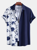 Camisa azul marino de mangas cortas con botones y estampado floral blanco y azul