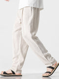 Pantalón harem de lino y algodón beige, tiro elástico y caída holgada