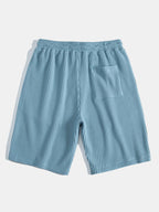 Pantalones cortos de punto a rayas con cordón, color azul claro